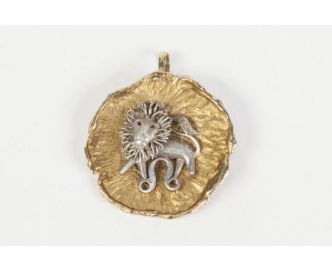 9ct GOLD 'LEO' BROOCH/PENDANT, with applied white gold lion over a 'Leo' Star sign, in the centre of a yellow gold textured c
