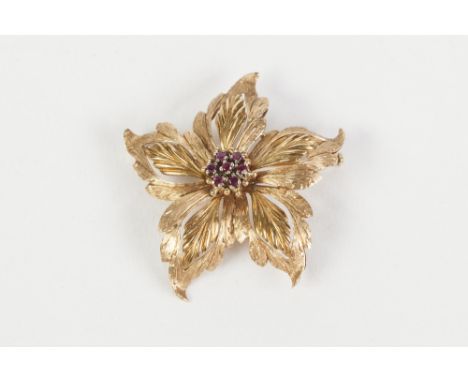 18ct GOLD FIVE PETAL FLOWER HEAD BROOCH, with centre cluster of seven tiny rubies, 4cm wide, London import hallmark 1959, 11.