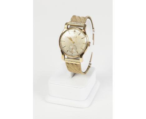 WITTNAUR, GENEVEVE, GENTS 18k WRIST WATCH with mechanical movement, circular silvered dial with batons and the gold plated me