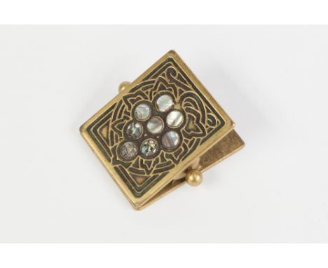 A TWENTIETH CENTURY TIFFANY STUDIOS, NEW YORK GILT BRASS AND ABALONE SHELL INLAID COILED SPRING DESK CLIP, impressed mark and