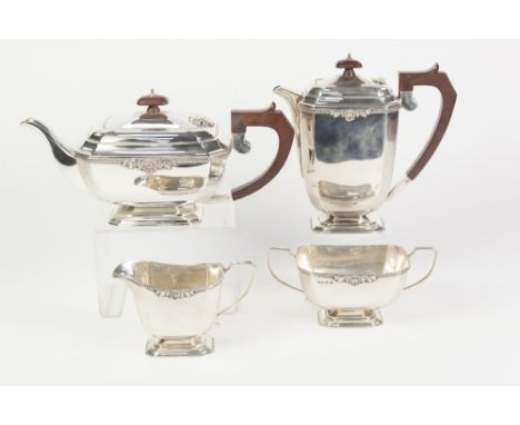 A POST WAR SILVER FOUR PIECE TEA AND COFFEE SERVICE, each of rounded canted oblong form with foliate and shell clasped gadroo