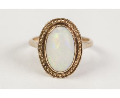 14k GOLD AND CABOCHON OVAL OPAL RING, 3.3gms, ring size 'J' 