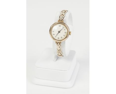 LADY'S WINEGARTENS, SWISS 9ct GOLD CASED WRIST WATCH, with jewelled movement, circular silvered Arabic dial and the rolled go