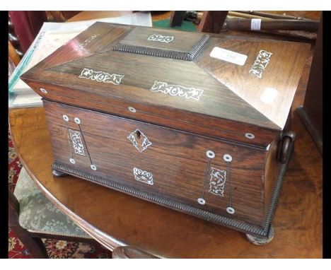 A 19th century rosewood and mother of pearl inlaid sarcophagus tea caddy with fitted interior and glass mixerCONDITION REPORT