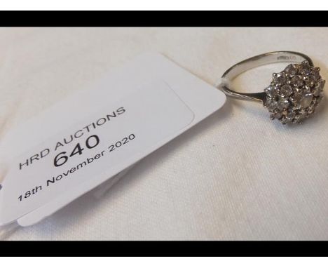 A diamond cluster ring (approx. 0.7 carat total) in 18ct white gold setting