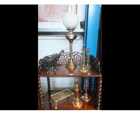 A Victorian oil lamp, pair of brass candlesticks, together with an ebony elephant etc