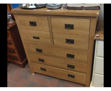 A modern light oak chest of drawers
