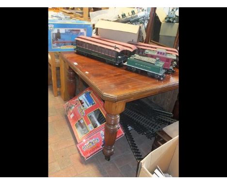 A model locomotive together with boxed Thomas the Tank Engine and Classic rail trainset