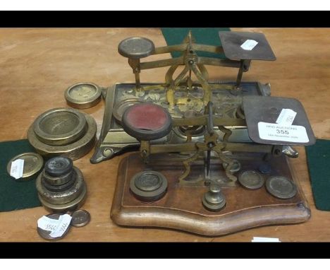 A set of postal scales with weights, together with one other