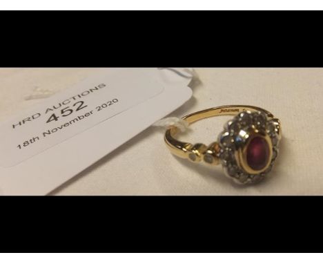 A ruby and diamond ring in 18ct gold setting