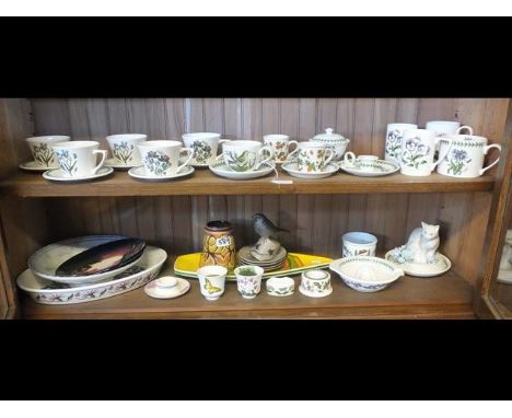 A selection of Portmeirion tea ware together with Poole pottery and other (on two shelves)