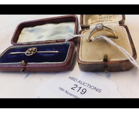 A diamond solitaire ring together with a diamond and sapphire brooch