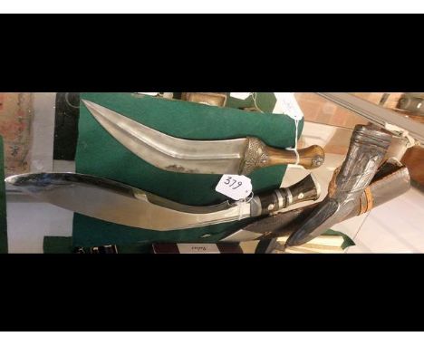A 44cm long Kukri together with a Middle Eastern dagger in scabbard CONDITION REPORTAs per images