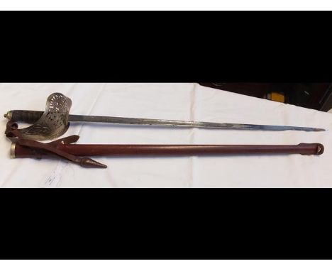 An antique military sword by Wilkinson, having engraved blade and leather scabbard - 102cm overallCONDITION REPORTBy our judg