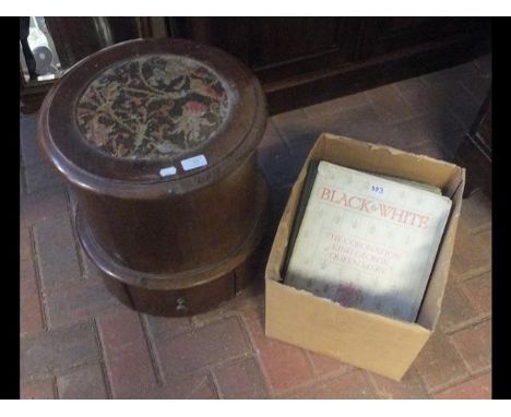 A Victorian circular commode with various books