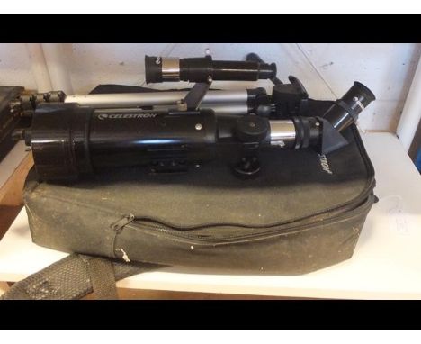 A Celestron travel scope with manual and travelling bag