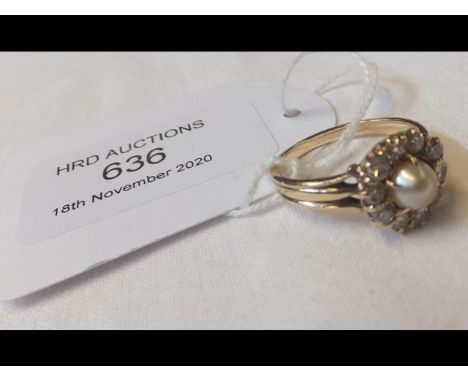 A ladies diamond and pearl ring
