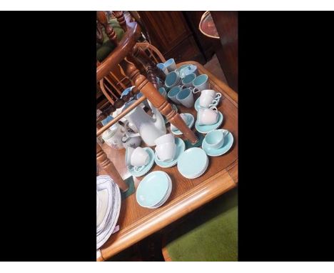A collection of Poole pottery including tea sets, preserve jar and cover