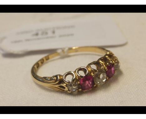 A ruby and diamond ring in 18ct gold setting