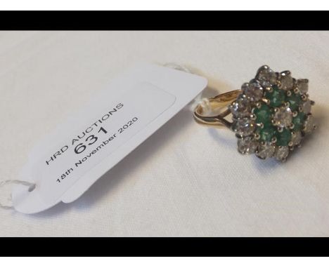 A diamond and emerald ring in 18ct setting - approx. 1.3 carat diamond weight