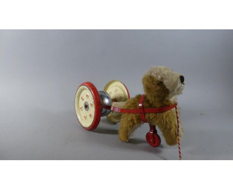 A Vintage Pull-a-Long Dog with Wheels and Bell by Chiltern Hygenic Toys 