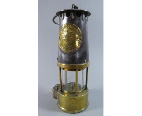 A Brass and Steel Miner's Safety Lamp by the Protector Lamp and Lighting Company Limited, Type HL and Numbered 52 