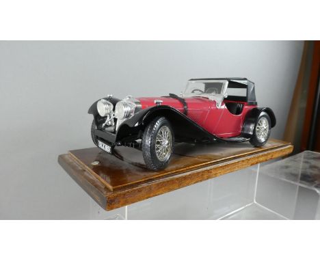 A Cased Bburago 1:18 Scale of a 1937 Jaguar SS100 