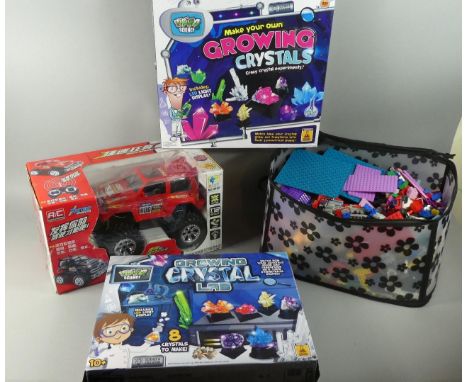 A Box of Miscellaneous Toys to Include R/C Truck, Mega Blocks and Two Grow Your Own Crytals 