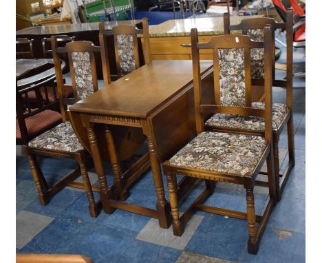 An Oak Drop Leaf Gate Legged Table and Four Tapestry Upholstered Dining Chairs 