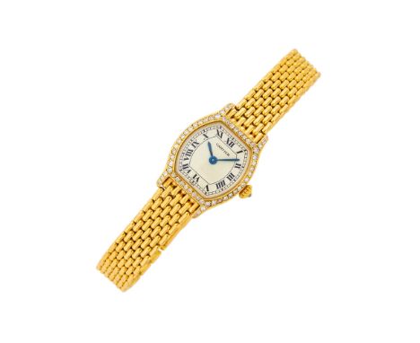 18 kt., quartz, silver-tone tonneau-shaped dial, black Roman numerals, outer track indicator, small single-cut diamond-set be