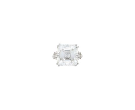 One square cut-cornered step-cut emerald-cut diamond weighing 15.23 cts., 6 tapered baguette diamonds ap. 1.40 cts. Size 5 3/