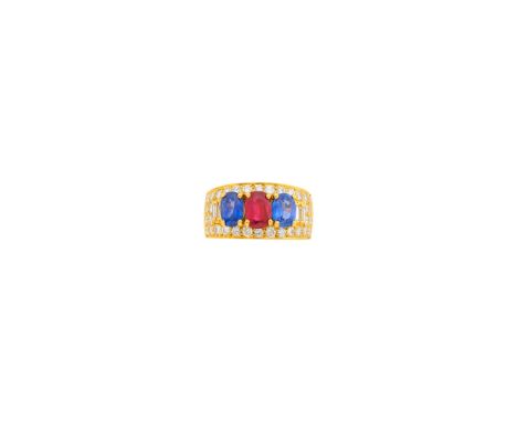 18 kt., one oval ruby weighing 1.10 cts., 2 oval sapphires weighing 1.51 cts., 34 round and 4 baguette diamonds weighing 1.29