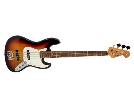 A Stagg electric base guitar with soft case, in good condition.