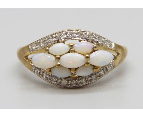 A 9ct gold, seven opal and eighteen diamond ring, 2.4g, P 