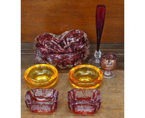 Two Whitefriars orange glass bowls, a ruby red bowl with controlled bubble decoration, a pair of ruby flash cut salts and two