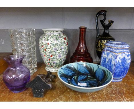 A Ringtons blue and white tea caddy, a retro glass vase, a Past Times vase, a ewer with Roman decoration, a red glass decante