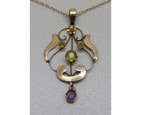 A 9ct gold Art Nouveau, amethyst and peridot pendant on a fine 9ct gold chain, 2.1g 