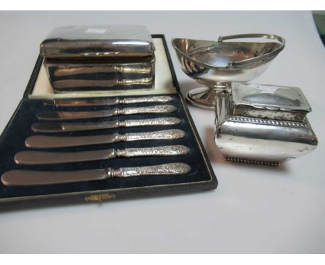 A silver sugar basket, a silver miniature tea caddy, a silver table cigarette box and a cased set of dessert knives with fill