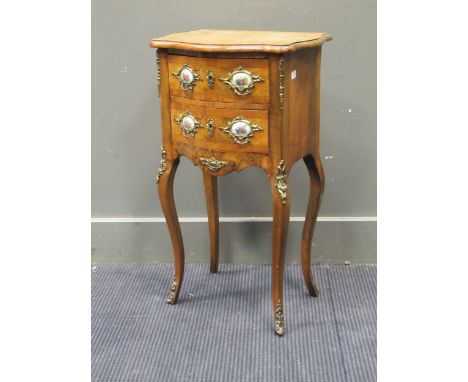 A French walnut petit commode of serpentine outline, fitted two drawers, on cabriole legs, 37cm wide