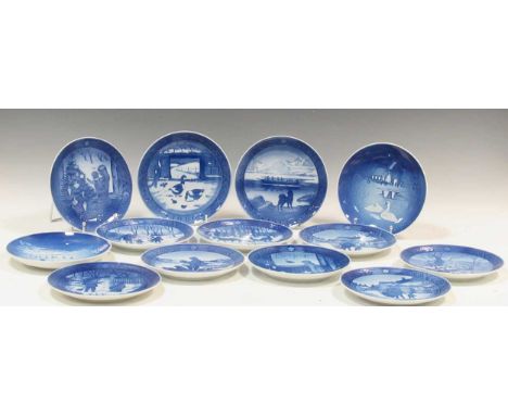 A collection of Royal Copenhagen ceramic plates, including 'The Queen's Christmas Residence'