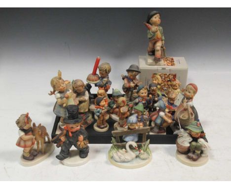 A collection of 23 Hummel figures