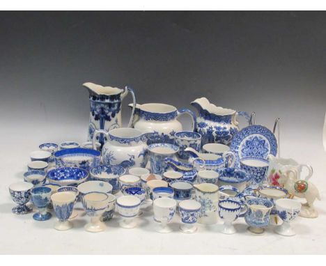 A collection of English ceramic egg cups, to include Wedgwood, Doulton, Cauldon examples and other blue and white wares (qty)