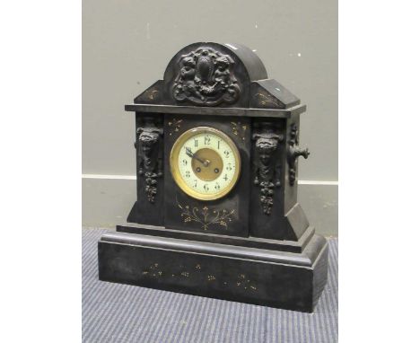 A marble mantel clock with applied metal mounts of putti and masks. 51cms high.