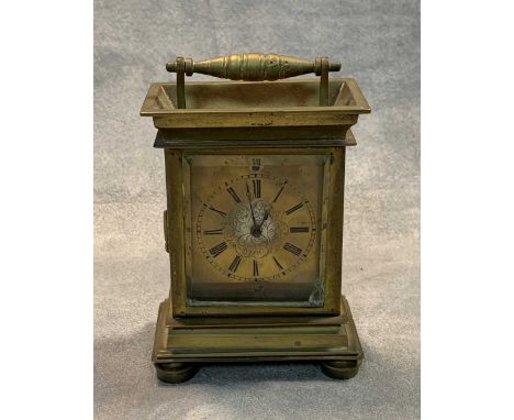 A 19th century brass carriage clock with a watch movement, signed by Andrew Flockhart, 13.5cm high