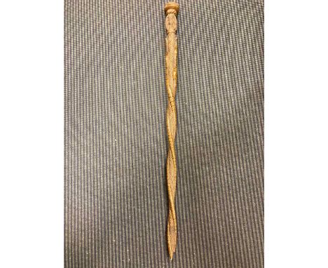 A carved wooden walking stick