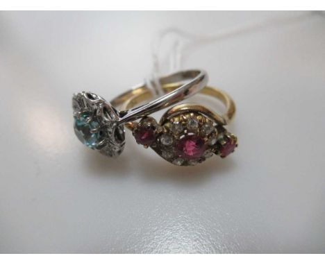 A blue zircon and diamond cluster ring, stamped '18CT', together with a ruby and diamond cluster ring stamped '18CT', gross w