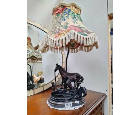 A bronzed resin figural table lamp of a blacksmith with horse COLLECT ONLY