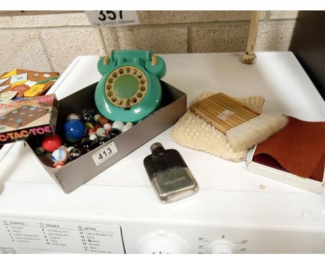 A box of vintage marbles, phone book, and a clutch bag and a Schweppes branded hip flask.