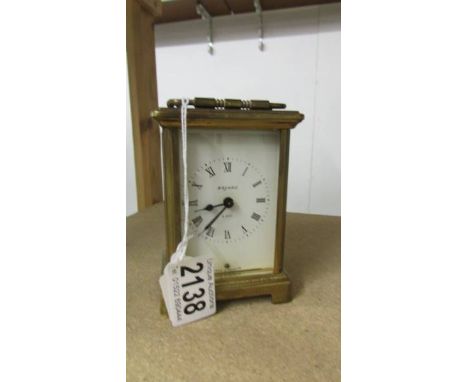 A brass carriage clock.