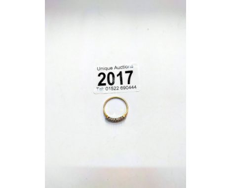 A 9ct gold and diamond ring, size M half. 1.5 grams.